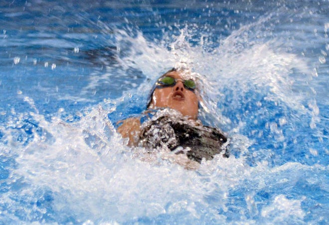 West Ottawa's Jacklyn Vande Poel swims the 200-yard backstroke relay at the West Michigan Relays on Saturday at West Ottawa. Dan D'Addona/Sentinel staff
