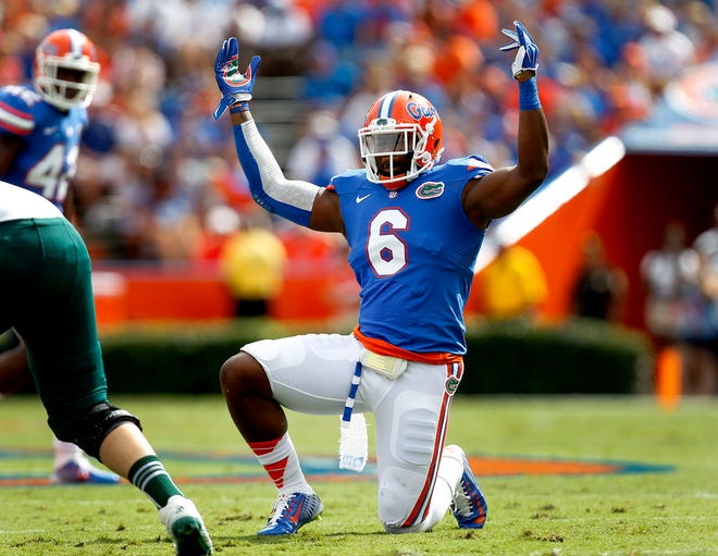 Florida Gators defensive lineman Dante Fowler, Jr. (6) pumps up the crowd before a play against the Eastern Michigan Eagles during the first half at Ben Hill Griffin Stadium on Saturday, Sept. 6, 2014 in Gainesville, Fla. Florida defeated Eastern Michigan 65-0.