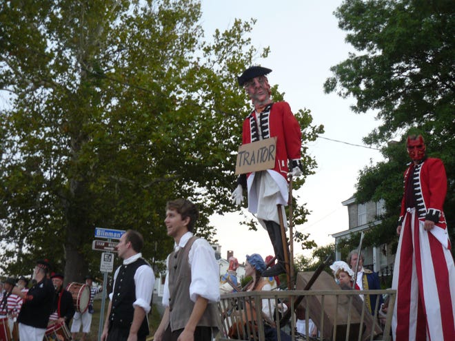 An effigy of Benedict Arnold is wheeled through the streets of New London on Saturday, part of the city's Burning of Benedict Arnold event.

John Penney/ NorwichBulletin.com