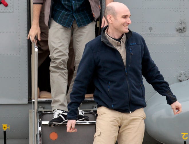 In this April 20 photo, released French hostage Nicolas Henin arrives at the Villacoublay military airbase, outside Paris.