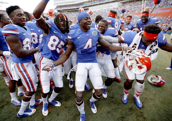 Florida Gators wide receiver Andre Debose (4) and wide receiver Chris Thompson (85) dance after the game against the Eastern Michigan Eagles at Ben Hill Griffin Stadium on Saturday, Sept. 6, 2014 in Gainesville, Fla. Florida defeated Eastern Michigan 65-0. (Matt Stamey/Staff photographer)
