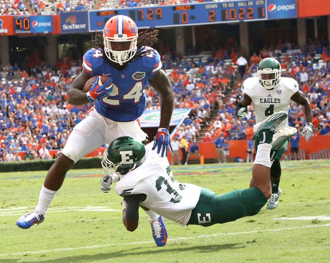 Florida Gators running back Matt Jones (24) runs with the ball during the first half of a football game against Eastern Michigan at Ben Hill Griffin Stadium on the UF campus in Gainesville Sept. 6, 2014.