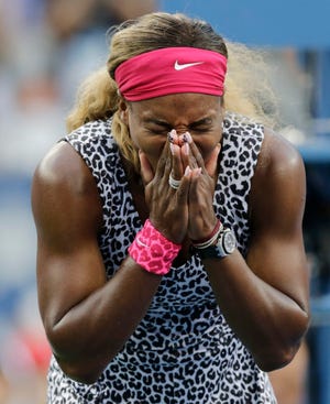 Serena Williams gets emotional after defeating Caroline Wozniacki in the women’s final of the U.S. Open tennis tournament Sunday in New York.