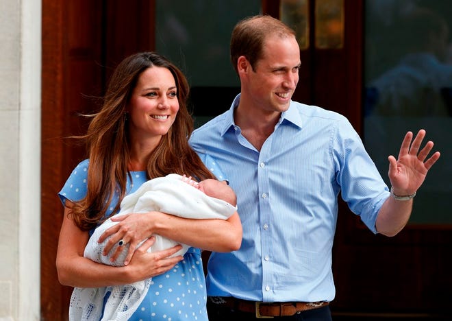 In this Tuesday, July 23, 2013, file photo, Britain's Prince William and Kate, Duchess of Cambridge hold George, the Prince of Cambridge, as they pose for photographers outside St. Mary's Hospital exclusive Lindo Wing in London where the Duchess gave birth on Monday July 22. The Duchess of Cambridge, wife of Prince William, is expecting her second child and was being treated for severe morning sickness, royal officials said Monday.