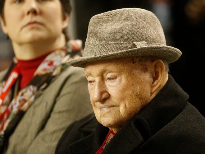 In this Dec. 31, 2012, file photo, S. Truett Cathy, the founder of Chick-fil-A, watches teams warming up before the first half of the Chick-fil-A Bowl NCAA college football game between Clemson and LSU in Atlanta. A spokesman said Cathy died early Monday.