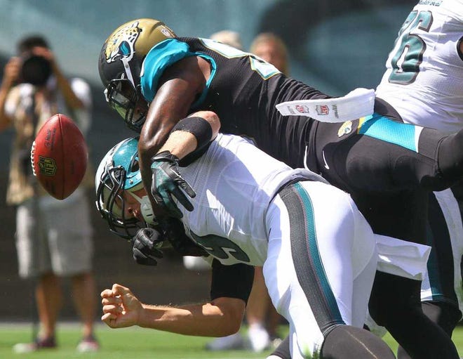 Jacksonville Jaguars defensive end Andre Branch sacks Philadelphia Eagles quarterback Nick Foles, causing a fumble during the first quarter of an NFL football game in Philadelphia, Sunday, Sept. 7, 2014. (AP Photo/The Wilmington News-Journal, Andre l Smith) NO SALES