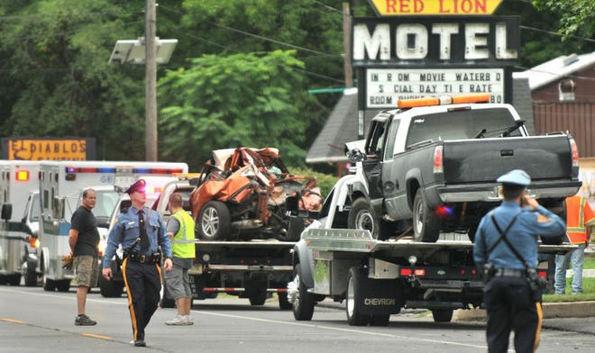 A pickup truck and a mangled car sit on a flatbed trucks on Route 206 South near the Red Lion Plaza in Southampton, NJ on Tuesday afternoon. Three vehicles were involved in the 3 p.m. accident. Two people were medivaced to Cooper University Hospital.