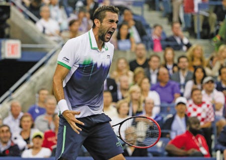 Marin Cilic reacts after a shot against Kei Nishikori during the championship match of the U.S. Open tennis tournament on Monday in New York.