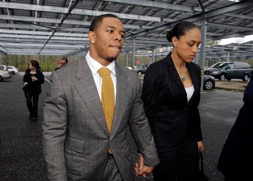FILE - In this May 1, 2014, file photo, Baltimore Ravens football player Ray Rice holds hands with his wife, Janay Palmer, as they arrive at Atlantic County Criminal Courthouse in Mays Landing, N.J. Banter by two "Fox & Friends" hosts about video showing Rice hitting his then future wife is under fire. The hosts, Brian Kilmeade and Steve Doocey, made their on-air comments Monday, Sept. 8, 2014, while discussing newly released elevator video showing Rice hitting Janay Palmer in February. (AP Photo/Mel Evans, File)