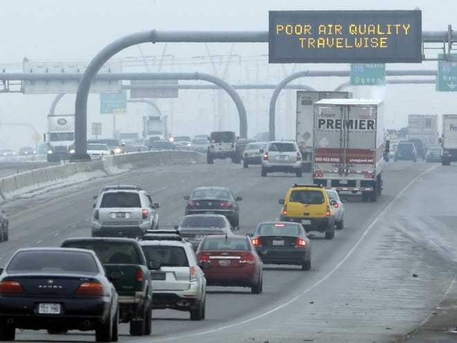 FILE - This Jan. 23, 2013, file photo, shows a poor air quality sign is posted over a highway, in Salt Lake City.