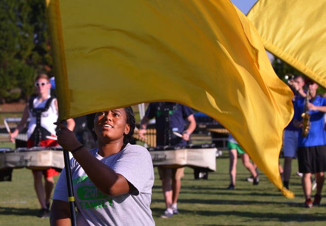 A member of the color guard practices with the Union County High School marching band recently.