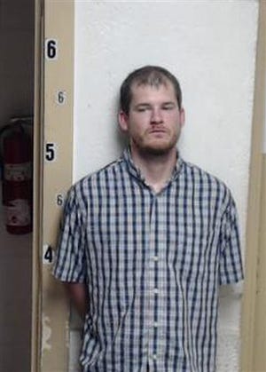 This Sunday, Sept. 6, 2014 photo made available by the Smith County Sheriff's Office shows Timothy Ray Jones Jr. On Tuesday, Sept. 9, 2014, authorities said the father of five children whose bodies were found in Alabama has been charged with child neglect and that other charges are pending.