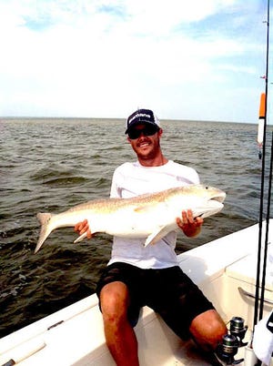 Photo courtesy of Capt. Eric TraubMike Purvis, fishing with Capt. Eric Traub, shows this monster bull red he landed and released. The fish measured 50 inches long and weighed 39 pounds.
