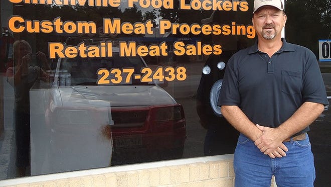 Owner Cliff Burns of Smithville Food Lockers, chamber business of the week, takes a break from his busy schedule.