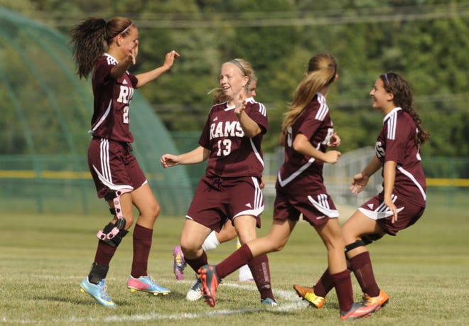 Lyndsay Micucci , left of Riverside celebrates with teammates after her goal in the first half of Thursday's game at Florence High School.