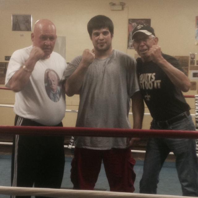 Dulac boxer Antonio Mignella (center) will fight Al Vermall Jr. at the “Title for Title” fight card in Rhode Island Friday. His trainers Kevin Rooney (left) and Elzie Verdin (right) will be in his corner at the fight.