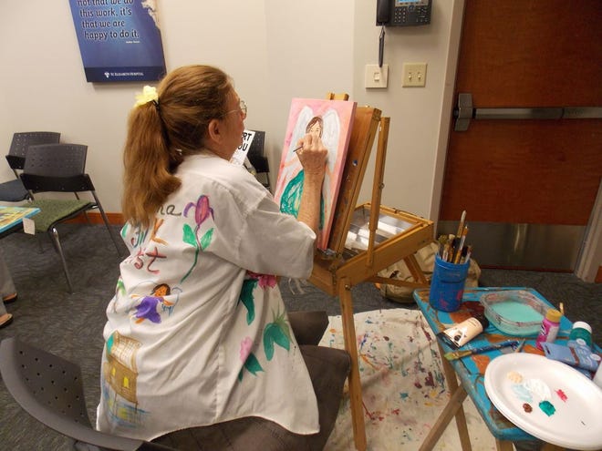 Local artist Mary Crochet, member of River Region Art Association, paints an angel during the Sept. 4 ABC meeting.
