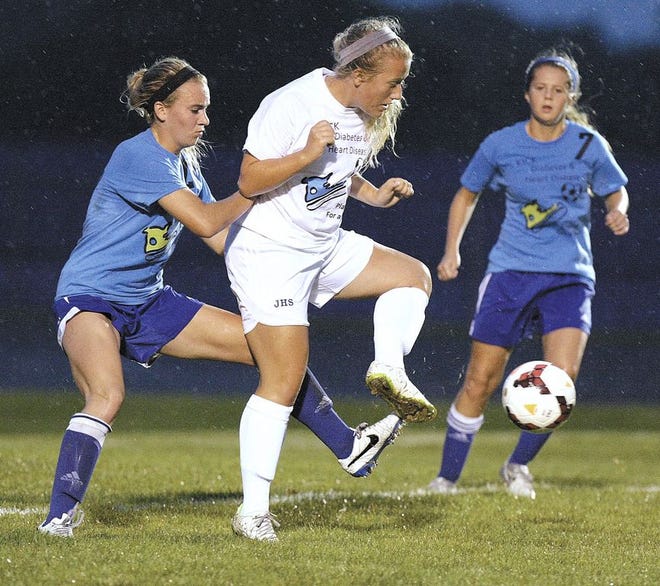 Jackson High School’s Ali Haupt defends the ball against Lake's Taylor Smith (left) and Alexis Meffert during the first half of Wednesday’s Federal League match. Jackson won the match 6-0, with Haupt scoring a goal and adding an assist.
