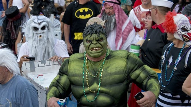 Costumed revelers participate in the 2013 Fantasy Fest Masquerade in Key West, attracted some 10,000 participants. The theme was Super Heroes, Villains … & Beyond. (Andy Newman/Florida Keys News Bureau/HO)