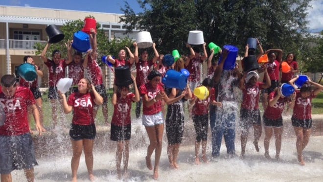 The Palm Beach Central High Student Government Association and new principal, Darren Edgecomb, douse themselves as part of the ALS Ice Bucket Challenge. The school was called out to participate by Wellington High’s SGA and Principal Mario Crocetti.
