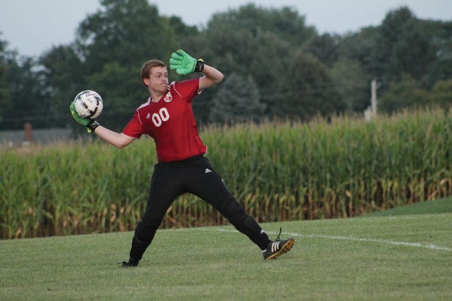 Metamora goalkeeper Owen Greenfield launches the ball after a save earlier this season. Greenfield had eight saves against Morton Sept. 2