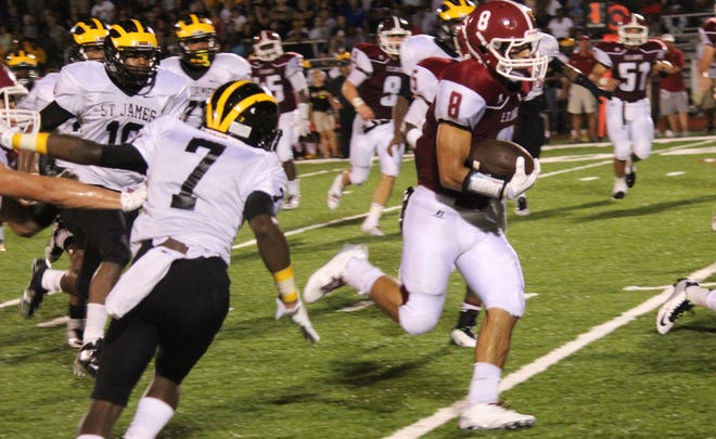 E.D. White running back Connor Chaisson (8) dashes for a 32-yard touchdown against St. James in Thibodaux on Friday.