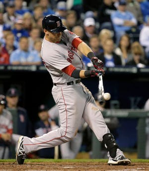 Boston Red Sox's Will Middlebrooks hits an RBI single during the third inning of a baseball game against the Kansas City Royals on Thursday, Sept. 11, 2014, in Kansas City, Mo.