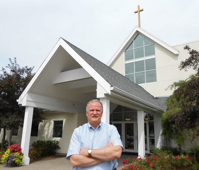 Senior Pastor Paul Atwater stands outside North River Community Church. The church recently celebrated its 25th anniversary. Photo/Mark Burridge