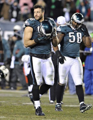 Eagles outside linebacker Connor Barwin (left) had his contract restructured, although it doesn't appear that the move was salary cap related but based on Barwin's outstanding 2014 season.
