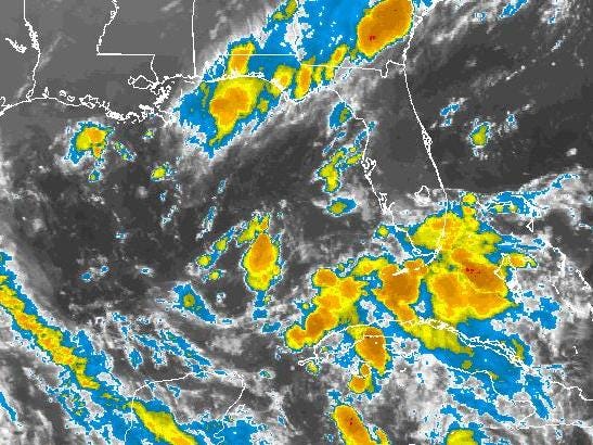 A NOAA satellite image shows a disorganized storm system over the Gulf of Mexico late tonight.