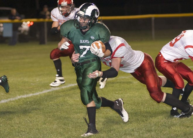 Stone Arnold looks for running room as a Camden defender tries tackle him during Friday night's homecoming matchup at North Adams. TODD LANCASTER PHOTO