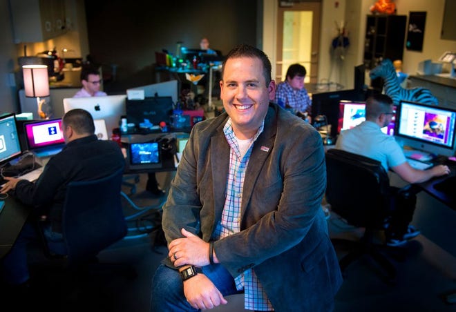 Jake Hamann, president and CEO of OneFireMedia, along with his creative team, generate digital media for several local major corporations, and are looking to grow. Part of the team works in their offices at the PeoriaNEXT Innovation Center.