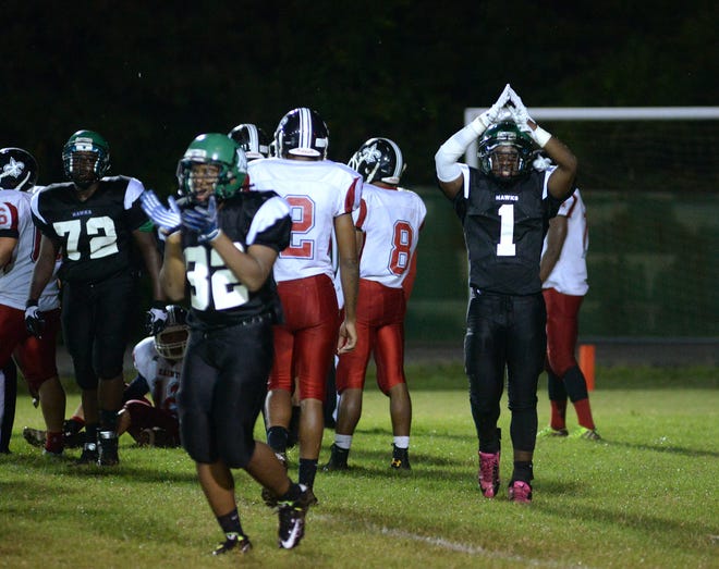 North Lenoir's Donyae Hopkins (1) celebrates a safety in the first quarter of Friday's game against Southern Wayne.