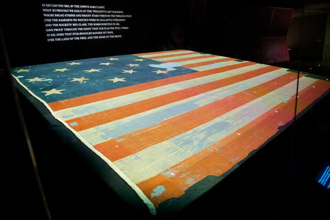 FOR Story by Reporter Brett Zongker Smithsonian's National Museum of American History exhibit of the flag that inspired the national anthem 'Star-Spangled Banner', Friday, Sept. 5, 2014 in Washington. Years ago parts of the flag were snipped off and handed out as mementos and the Smithsonian has been reacquiring some of those fragments and adding to their collection. (AP Photo/Pablo Martinez Monsivais)