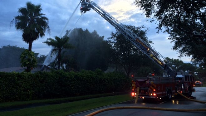 Fire Rescue crews work to put out a house fire near Boca Raton. Photo courtesy of Palm Beach County Fire Rescue