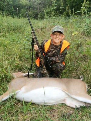 First deer are memorable for many reasons. Young 10-year-old Kale Sher was all smiles after taking his first deer, this nice, big doe, last weekend with his Dad, Eric.