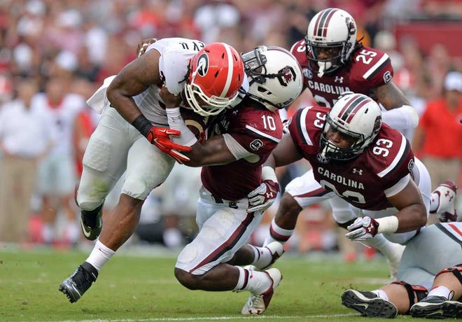 Brant Sanderlin Associated Press Georgia running back Todd Gurley is tackled by South Carolina's Skai Moore (10) on Saturday in Columbia, S.C.