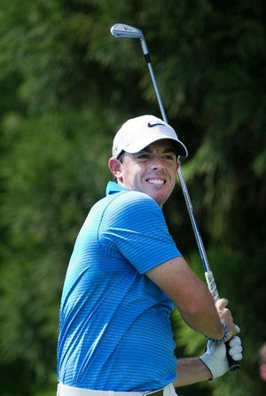 Rory McIlroy watches his tee shot on the second hole during the third round of play in the Tour Championship on Saturday.