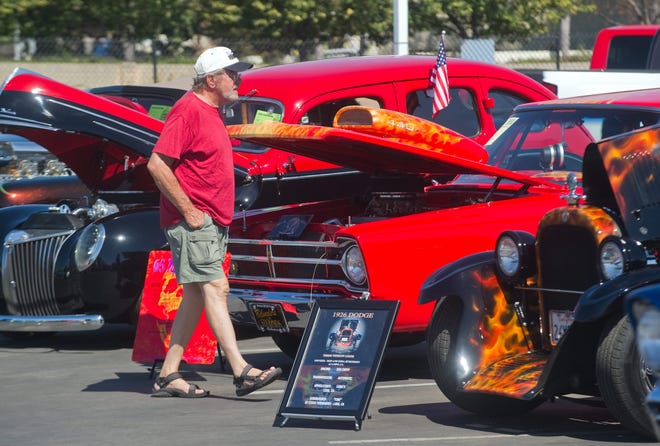 Chuck Reeder of Stockton looks at the cars on display at the Toys For Tots car show Sunday at Chase Chevrolet. CLIFFORD OTO/The Record