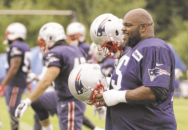 New England Patriots defensive tackle Vince Wilfork (75) walks during a stretching session before practice begins at the NFL football team's facility Thursday, Sept. 11, 2014 in Foxborough, Mass.