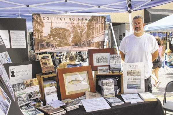 File photo
Local author and historian Michael Maddigan with a display of his work at the Krazy Days celebration this summer. "The Nemasket River Herring" is his latest book on the Middleboro-Lakeville area.