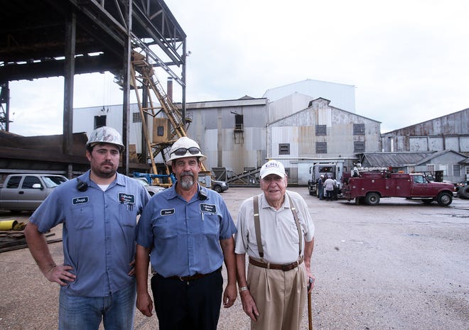 Three generations of the Legendre family: Joseph (from left), Duane and Lloyd pose Monday in front of the Lafourche Sugars plant in Thibodaux.