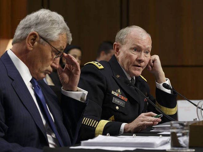 Defense Secretary Chuck Hagel and Army Gen. Martin Dempsey, right, chairman of the Joint Chiefs of Staff, appear before the Senate Armed Services Committee, the first in a series of high-profile Capitol Hill hearings that will measure the president's ability to rally congressional support for President Barack Obama's strategy to combat Islamic State extremists in Iraq and Syria, in Washington, Tuesday, Sept. 16, 2014.
