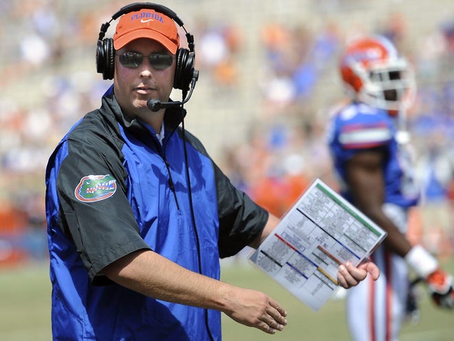 Florida's new offensive coordinator Kurt Roper watches during their spring game April 12 in Gainesville.