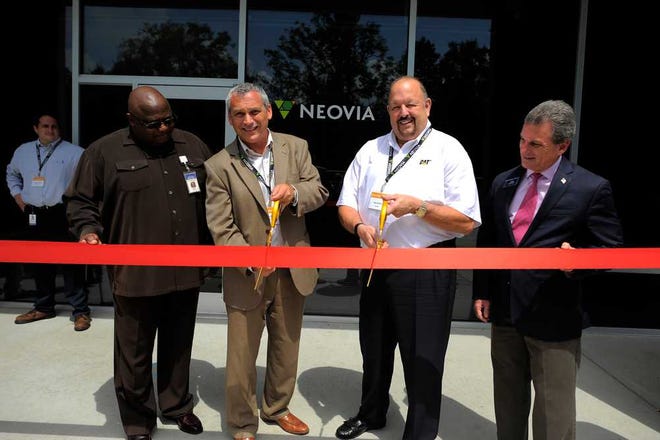 Stephen Morton Photography From the left, Georgia State Rep. Bob Bryant, Neovia Senior Vice President Eric Cagle, Caterpillar General Manager for Global Network Operations Greg Janssen and State Senator Buddy Carter take part in a ribbon cutting Monday for the new Neovia Logistics container crossdock facility off Dean Forest Road.