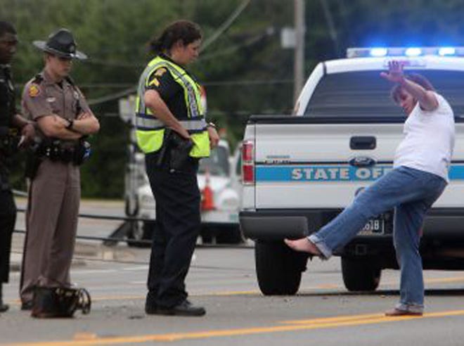 Sgt. Melanie Law, with the Panama City Police Department’s traffic unit, conducts a field sobriety test on the driver of the vehicle that hit a power pole along 23rd Street in Panama City on Tuesday. The driver was charged with a DUI.