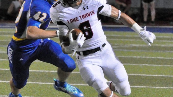 Lake Travis’ Cade Green turns upfield after one of his eight first half receptions, two of which went for touchdowns.