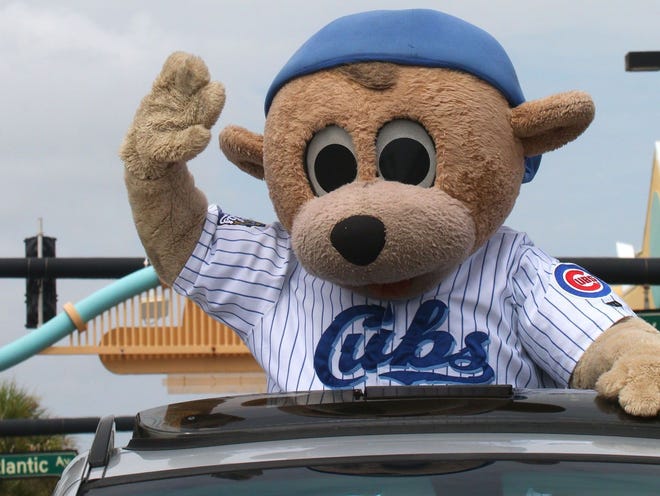 Cubby waves to the crowds during the third annual 4th of July Parade on Main Street sponsored by Joe's Crab Shack in Daytona Beach on July 4, 2014.