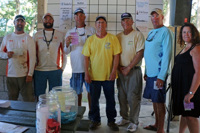 Winners of the inshore classic fishing tournament include, from left, Shane Moore, Dallas Moore, Justin Spicer, Bill Fisher, Bob Fisher, Norm Manley and Mrs Bill Moore.