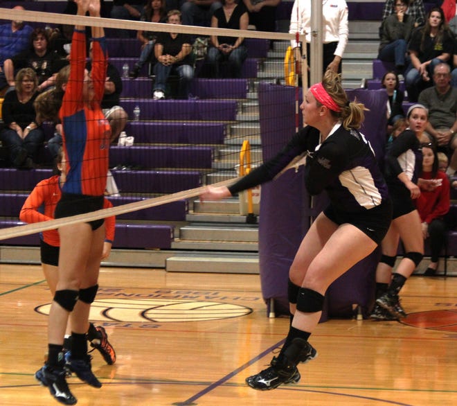 Mount Pulaski senior outside hitter Whitney Nichols spikes a shot during the first set against Decatur St. Teresa at home Tuesday night. Photo by Bill Welt/The Courier